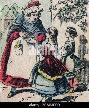 Le pere fouettard, personnage legendaire du folklore, et son epouse la mere Fouettard, qui donne des dragees aux enfants sages, Image d'Epinal, 19eme Stock Photo