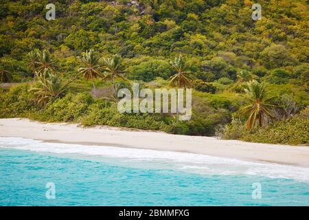 The pristine and hard to reach beach in the Rendezvous Bay in Antigua. Stock Photo