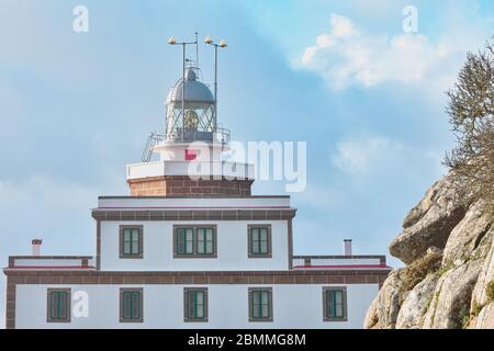 Detail of the Finisterre Lighthouse, on the Camino de Santiago route. In the light of day, in a sky with clouds. Galicia, Spain Stock Photo