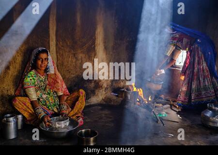 India, Gujarat, Kutch, Ludiya village, Meghwal ethnic group, women working in the kitchen Stock Photo