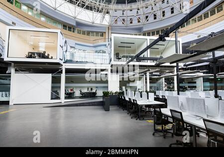 Business crisis. Big rental office with wrapped computers Stock Photo