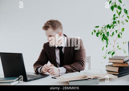 a man works in the Office at the computer business clerk Stock Photo