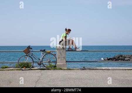 Ostia, Italy. 09th May, 2020. Woman on the seafront of Ostia, near Rome, on the morning of Saturday 9 May 2020, during Phase 2 of the Covid-19 pandemic (Photo by Matteo Nardone/Pacific Press/Sipa USA) Credit: Sipa USA/Alamy Live News Stock Photo