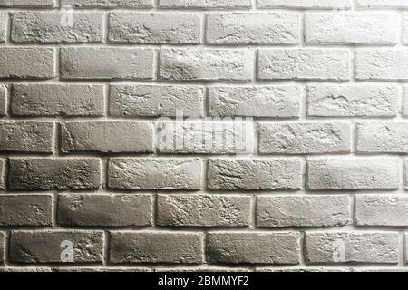 White brick wall, shadow and gradients, volume, from white to gray. Texture background for design and layouts. Stock Photo