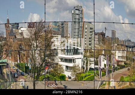 Rotterdam, The Netherlands, March 14, 2020: the city's skylien including Chabot museum, Park hotel, Arminius church reflecting in the facade of the ne Stock Photo