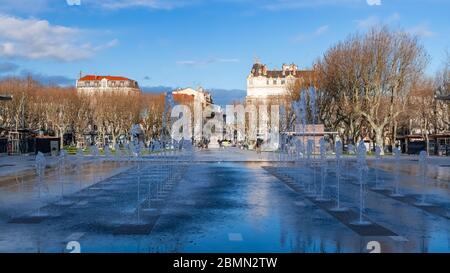 Béziers in France, the Jean-Jaures place, typical facades in the old center, with water jets in a public park Stock Photo