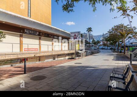 Closed businesses and shops in La Nina commercial center, Torviscas during the covid 19 lockdown in the tourist resort area of Costa Adeje, Tenerife, Stock Photo