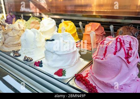 Assortment of ice cream at street shop. Ice cream in showcase fridge at confectionery shop Stock Photo