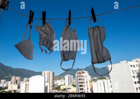 masks drying after washing to sterilize covid-9 in a apartment balcony Stock Photo