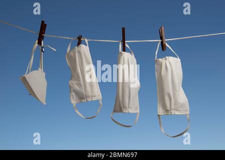 masks drying after washing to sterilize covid-9 in a apartment balcony Stock Photo