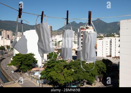 masks drying after washing to sterilize covid-9 in a apartment balcony Stock Photo