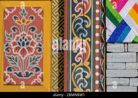 Bhutan, Punakha. Sopsokha village, Gateway to the Chimi Lhakhang monastery aka Fertility Temple. Detail of traditional colorful architecture. Stock Photo