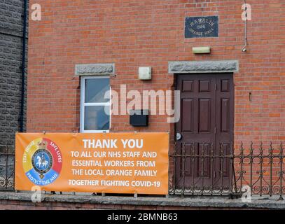 Magheralin, County Armagh, Northern Ireland. 10 May 2020. UK weather - cooler and breezy in the north-easterly wind but a very pelasant spring day nonetheless. NHS and essential workers 'Thank You' banner outside the local orange lodge hall.  'ThankCredit: CAZIMB/Alamy Live News. Stock Photo