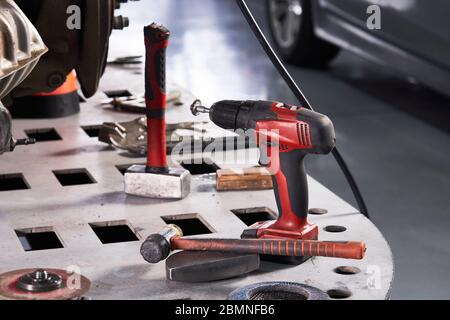 Car repair tools on the table in auto repair shop Stock Photo