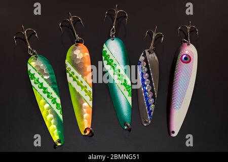 Fishing bait with treble hooks on a damp rock Stock Photo - Alamy