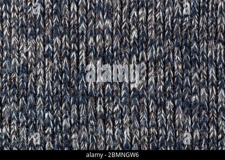 macro photo of warm gray melange polyester sweater with even vertical structure Stock Photo