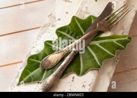 old fork with knife over the white shabby table Stock Photo