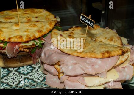 Pita with ham, cheese and salami display at the market. Italian street food Stock Photo