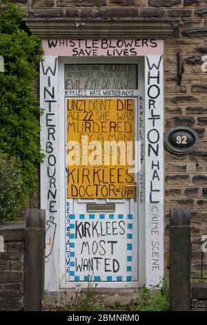 Meltham, UK - May 5 2020: A house in Meltham covered with writing and signs protesting against Kirklees Council. Stock Photo