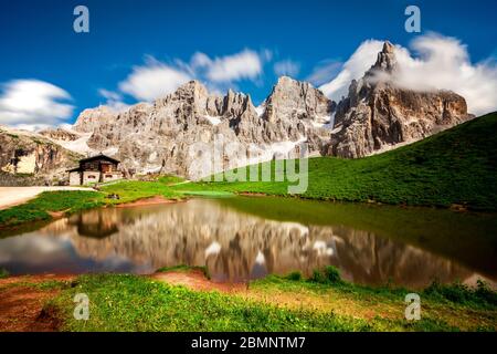 Reflection of Pale di San Martino in the lake, Passo Rolle, Trento, Trentino Alto Adige, Italy, Southern Europe Stock Photo