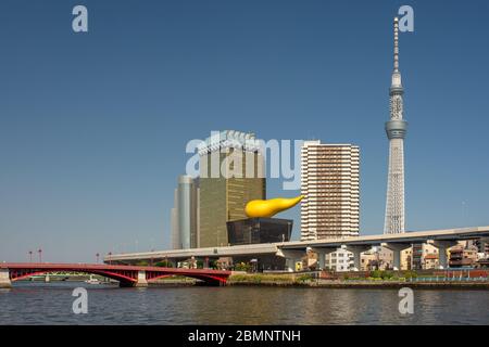 Tokyo / Japan - April 20, 2018: Tokyo Skytree and Asahi Beer Headquarters building, view from across Sumida river, Tokyo, Japan Stock Photo