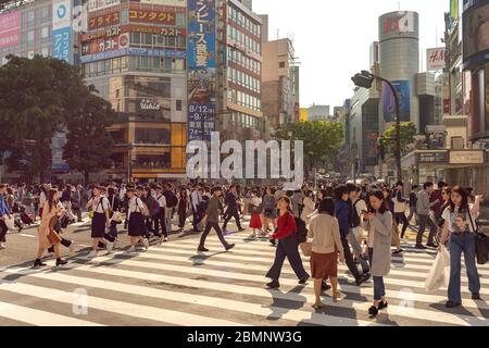 Tokyo / Japan - April 20, 2018: People crossing the famous Shibuya intersection in Tokyo, Japan Stock Photo
