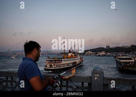 Istanbul, Turkey - 04 September 2019 : Fisherman at Galata Bridge Stock Photo