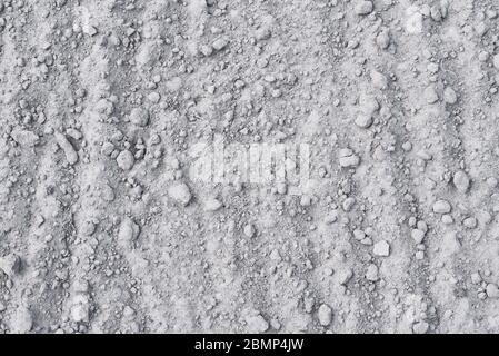 Dry soil background. Sand with stones as texture Stock Photo