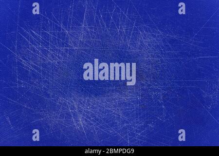 Blue, plastic, grained cutting board with a lot of scratches. Stock Photo