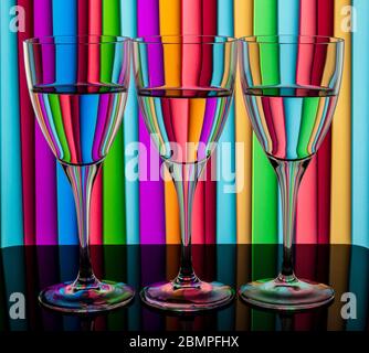 Glasses of water against a stripped background. Water in refracting light. Still life Stock Photo