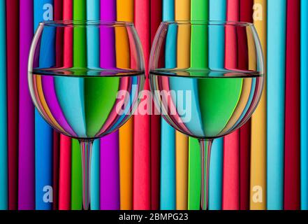 Glasses of water against a stripped background. Water in refracting light. Still life Stock Photo