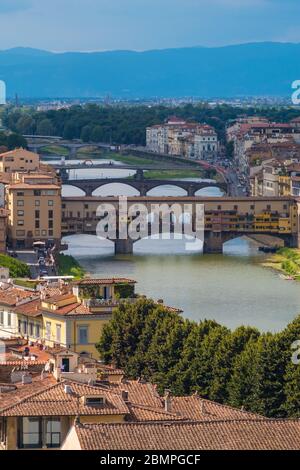 Florence, Italy - August 16, 2019: Florence cityscape and bridges on Arno River in Tuscany, Italy Stock Photo