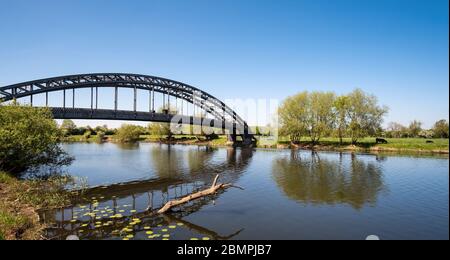 Long single span bridge across a river Stock Photo