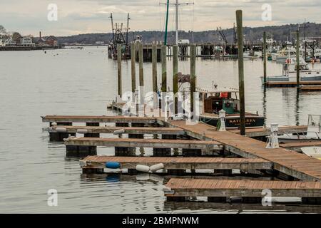 Located downtown this small area looks out on the Inner Harbor of Gloucester, Mass. Plenty of fishing boats here day in and day out. Busy harbor 24/7. Stock Photo