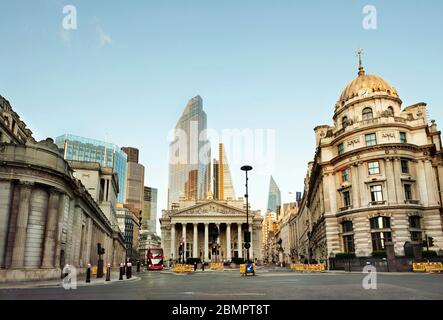 The City of London with the Bank of England (left); The Royal Exchange (centre) and No. 1 Cornhill building. Day 7 of the lockdown, London, Mar 2020 Stock Photo