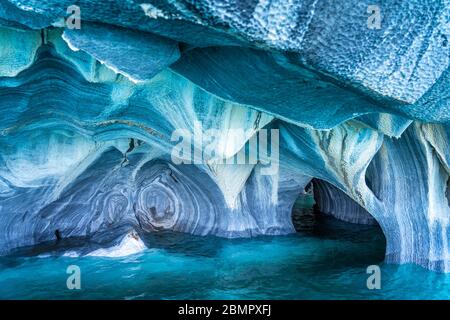 The Marble Caves (Spanish: Cuevas de Marmol ), a series of naturally sculpted caves in the General Carrera Lake in Chile, Patagonia, South America. Stock Photo