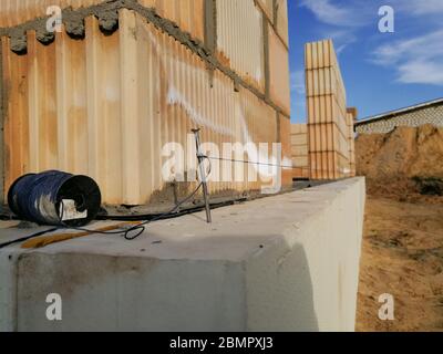Nail and string for ceramic building block construction leveling in construction site Stock Photo
