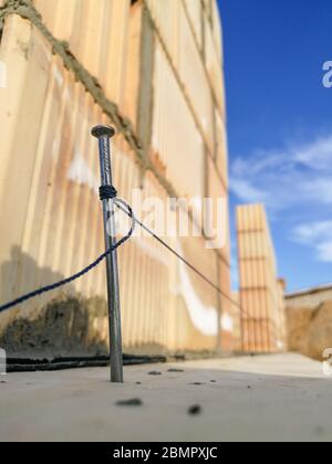 Nail and string for ceramic building block construction leveling in construction site Stock Photo