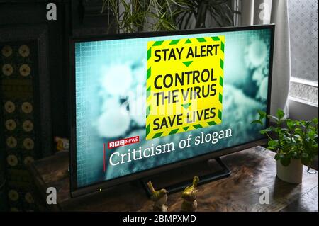 The new covid-19 public information slogan- 'Stay Alert, Control the Virus, Save Lives ' on television. Stock Photo