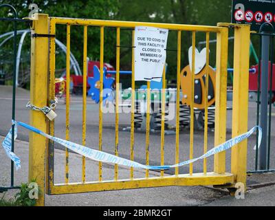 The locked gate to a children’s playground closed during the Covid 19 lockdown in 2020 Stock Photo