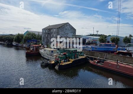 A boat yard which repairs canal boats, on the banks of the River Calder in Wakefiel serving the Calder and Hebble Navigation inland waterway. Stock Photo