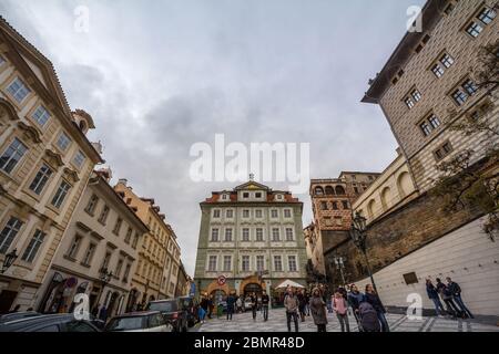 PRAGUE, CZECHIA - NOVEMBER 2, 2019: Crowd of tourists on a square on Nerudova street, a pedestrian alley of Hradcany hill, on the Prague Castle, surro Stock Photo