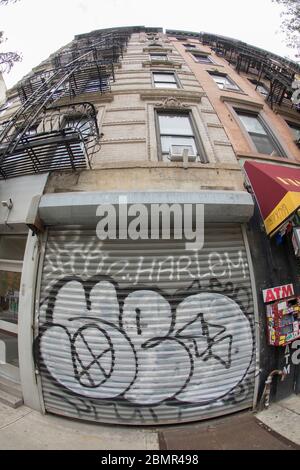 New York City, New York, USA. 9th May, 2020. Since the enforced quarantine during the COVID-19 pandemic, grafitti on storefronts, residences and vechicles has increased. Credit: Billy Tompkins/ZUMA Wire/Alamy Live News Stock Photo