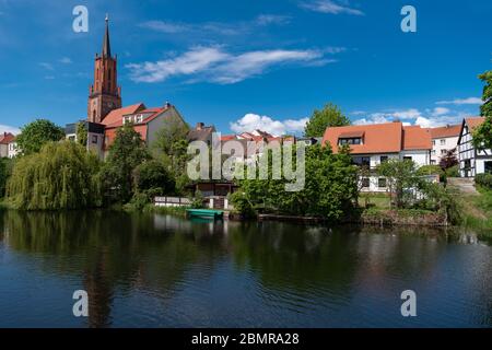 Rathenow, Germany. 05th May, 2020. The protestant town church of St. Marien und Andreas on the banks of the town canal that flows into the Havel. The original construction of the town church dates back to the 13th century and was also made of bricks. At the end of the war in 1945 the church was severely damaged by artillery fire and incendiary grenades and burned out. The tower was restored in 2011, as was the vault in the Chapel of Our Lady and, one year earlier, the vault in the central nave. The restoration is not yet complete. Credit: Soeren Stache/dpa-Zentralbild/ZB/dpa/Alamy Live News Stock Photo