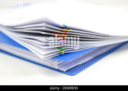 close up of Stack of papers files piles of unfinished documents achieves with paper clips Stock Photo