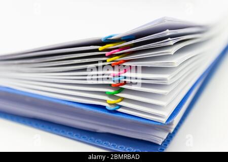close up of Stack of papers files piles of unfinished documents achieves with paper clips Stock Photo