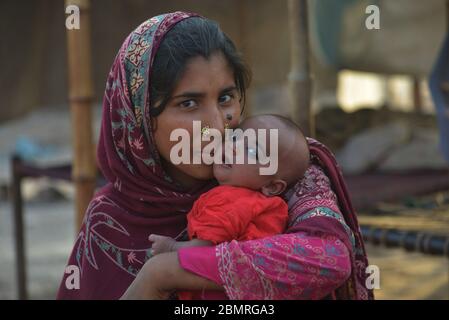 Pakistani mothers and their babies Stock Photo - Alamy