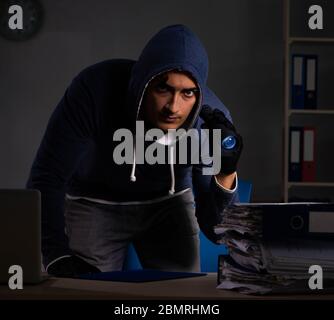 The thief trying to steal personal data in identity theft concept Stock Photo