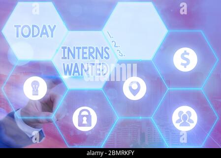 Writing note showing Interns Wanted. Business concept for Looking for on the job trainee Part time Working student Stock Photo