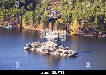 Majestic nature of Kazakhstan concept: epic view of Burabay lake with Zhumbaktas rock at sunrise in autumn season Stock Photo